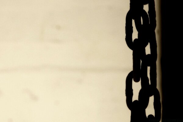 A weighing black chain on a gray background photo