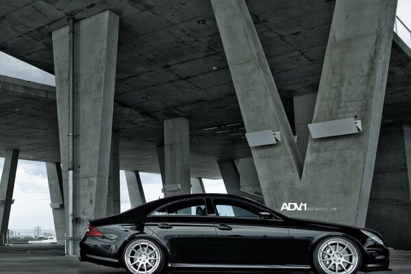 Black car under the bridge